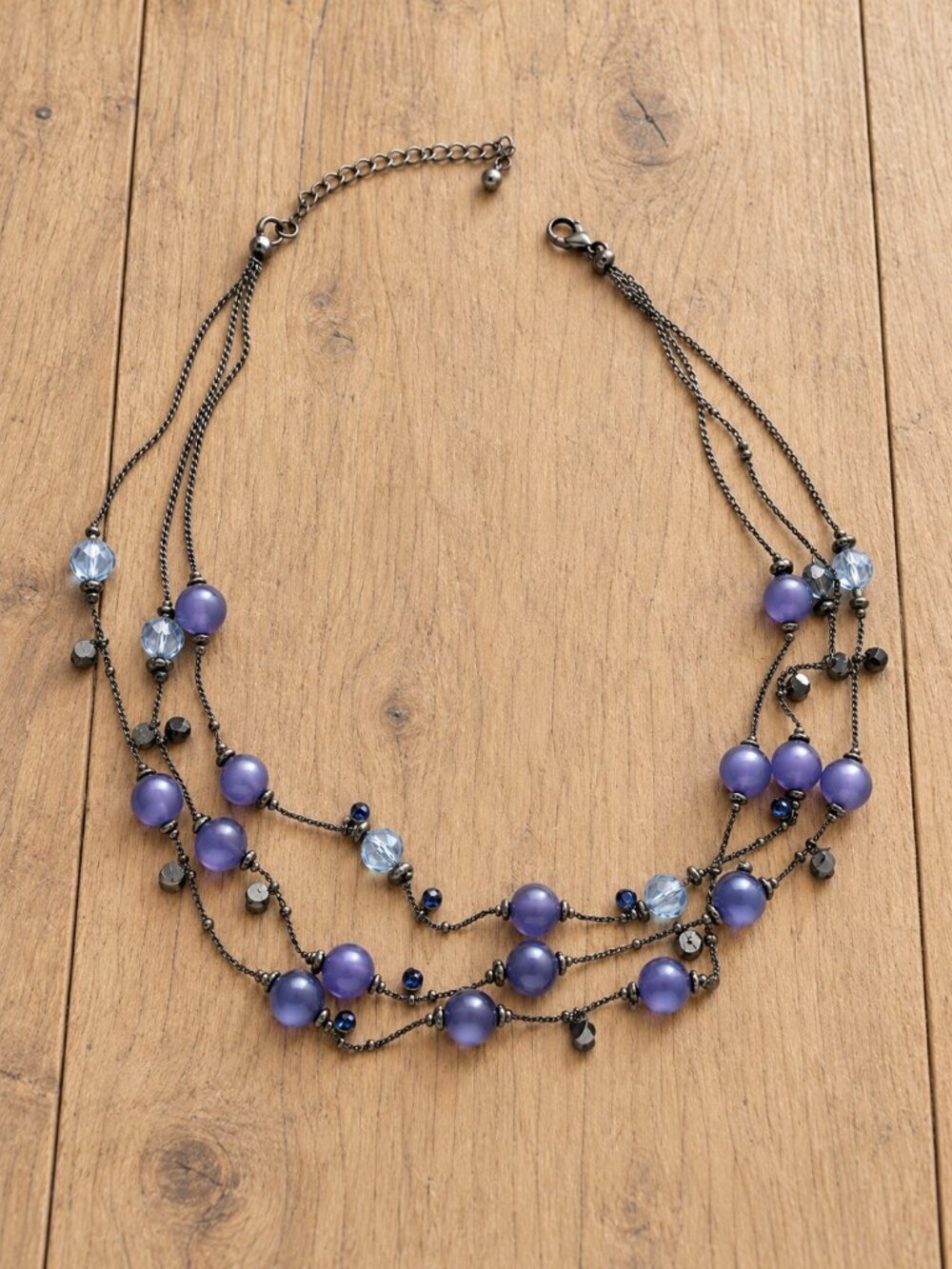 3 strand gunmetal silver tone necklace with purple and blue beads